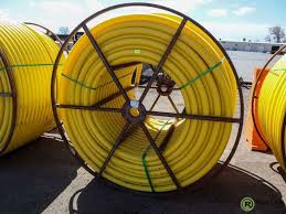 Spool of 2" Yellow Poly Pipe - Roller Auctions