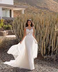 Pronovias On Instagram Dreaming Of A Cloud Of Tulle Skirt And The Richest Lace Bodice Of Th White Beach Wedding Dresses Designer Bridal Gowns Wedding Dresses
