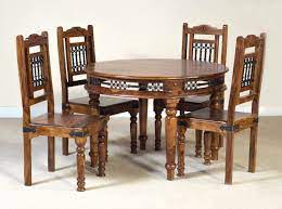 The wide collection comprises beautifully designed solid wood kitchen tables chairs that ensure users are comfortable and happy, always looking forward to their dining moments. Solid Sheesham Wood Round Dining Table Set With 4 Chairs Furniture Online Buy Wooden Furniture For Every Home Sunrise International