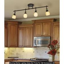 Made from metal, this light hangs from an adjustable cord and circular canopy that can be installed on a sloped ceiling. 30 Stunning Kitchen Lighting Ideas And Tricks For Old Homeowners Kitchen Lighting Fixtures Ceiling Kitchen Ceiling Lights White Kitchen Lighting