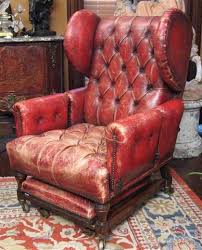 A Victorian Red Leather Reading Chair The Button Tufted Reclining Square Back Flanked By Wings Over A Button Tufted Sea Reading Chair Chair Modern Accent Chair