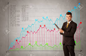 a confident young businessman standing in front of a a chart