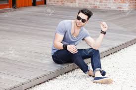 Attractive Young Male Model Posing Outdoors Stock Photo Picture And Royalty Free Image Image 16865298 There's such a fine line between getting it right and getting it really wrong the first step to mastering male photography poses is to relax.