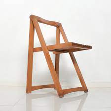Do not keep warm or cold items directly on this product. Mid Century Modern Folding Carry Set Of 4 Slatted Wood Chairs Romania For Sale At 1stdibs
