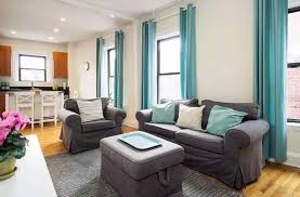 Living room with brown couch and glass chandelier. What Colors Go Good With Brown Interior Design Ideas Designing Idea