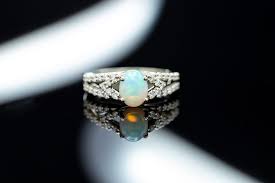 This rose gold beauty features four opal stones and clusters of diamonds to deliver a serious wow factor. An Incredible Union Of Colors Choosing Opal Engagement Ring Stones Igs