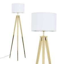 Boasting a sleek tripod design with slim metal legs and base, this distinctive floor lamp updates your space with understated style, and the base is topped off with a white drum shade that gently diffuses light for a soft glow. Nero Gold Tripod Floor Lamp White Shade Value Lights