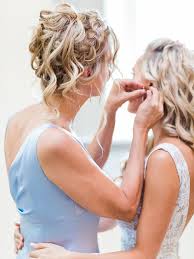I would see the bride all done up and then the bridesmaids would be rocking a complimentary hairdo that was half up and half down. 51 Mother Of The Bride Hairstyles We Love For Moms In 2020