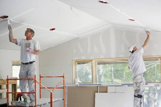 Drywall panels fastened to interior wall framing in a home