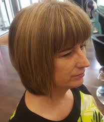 People who are fond of straight haircuts can try this. Short Layered Bob With Bangs Over 50 Bpatello