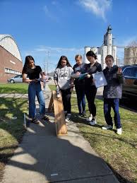 8th grade science students enjoyed the fresh air today while studying  velocity, acceleration and forces using ramps and weighted cars.
