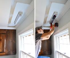 Remove all screws holding the fixture up to the ceiling and detach the wires from the wires in the ceiling. How To Replace Fluorescent Lighting With A Pendant Fixture Young House Love