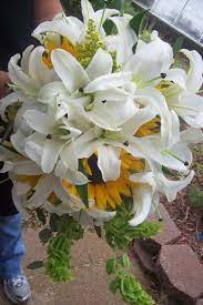 Find a stargazer lily wedding bouquet to add a splash of color to your celebration, or seek out yellow. Pin By Butterfield Florist On Wedding Sunflower Wedding Bouquet Wedding Bouquets Cascading Wedding Bouquets