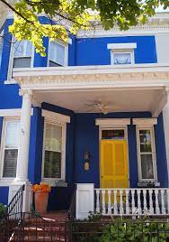 Combing the peacefulness of the color blue and the uplifting spirits and regal beauty of the color purple, this bedroom interior is perfect for homeowners who are free spirited and artistic. Royal Blue Bright White With Yellow Door House Exterior Blue Blue House White Trim White Exterior Houses