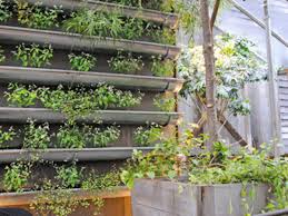 Vertical gardening is nothing more than using vertical space to grow vegetables (or herbs, or flowers, even root crops), often using containers that hang on a sunny wall. 6 Verdant And Wonderful Ideas For Vertical Gardens Organic Authority