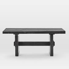 Unfinished wood has a rugged surface texture that will soften with age and use. Emmerson Reclaimed Wood Dining Table
