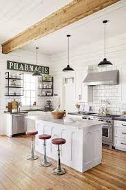Who knew that cool, metallic lines and cozy, country vibes played so well together? Joanna Gaines Opens The Door To Her Dreamy Family Farmhouse Architectural Digest Cuisine Maison De Ferme Style Cuisine Ferme Moderne