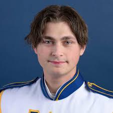Mary Wentzel, 17, of the New Hope-Solebury High School Band, tunes her  French horn before joining the Thanksgiving Day Parade.