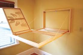 Then hang a drying rack from it. Surprise A Hidden Drying Rack That Holds 27 Items Hidden Drying Rack Wall Mounted Clothes Drying Rack Drying Rack Diy