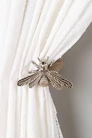 Measure 12 inches up from the bottom of the window or the curtains if the curtains are 55 inches long. 37 Metal Tieback Ideas Tieback Curtains Curtain Tie Backs