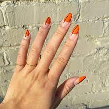 Bright orange nails with leaf accents. 26 Orange And Black Nail Designs You Can Wear All Season