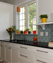 I Like The Boldness Of Color On This Backsplash Or Is It Mainly The Bright Cache Pots With Images Contemporary Kitchen Black Countertops Kitchen Tiles