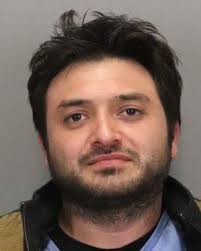 MAN CHARGED IN ATTEMPTED MURDER OF PRISON OFFICER DIES IN JAIL The suspect  who was charged with two counts of attempted murder, including