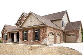 Modern farmhouse brick and stone exterior. Blending Traditional Exteriors With Modern Trends James Hardie Pros