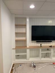 For someone who is handy with tools, building a wooden tv cabinet can be a relatively easy and fun project. Diy Built In Entertainment Center Ashley Jolley