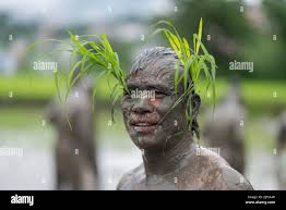 Mud covered farmer hi-res stock photography and images