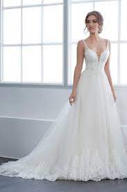 A Plunging Neckline And Sheer Side Panels Add A Perfect Update To This Flattering A Line Shape Spaghetti Strap Wedding Dress Wedding Dresses Ball Gowns Wedding
