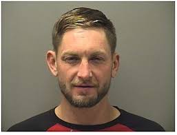 Husband allegedly threatens wife with hammer