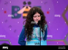 Abigail Violet Spitzer Of El Paso, Texas, Covers Her Face As She  Concentrates During The Semifinal Round Of The National Spelling Bee,  Thursday, May 31, 2012, In Oxon Hill, Md. (Ap Photo/Evan
