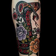 At black cobra tattoo studio our goal is to provide our clients with the highest quality tattoos in a relaxed, friendly, and safe setting. Traditional Cobra Snake With Flowers Tattoo Design For Sleeve