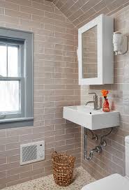 The subtly shifting colors and textures of the different stones add a lot of depth to the room, making it feel larger and more spacious than it is. River Rock Bathroom Design Ideas
