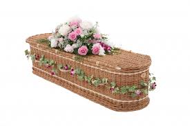 The photo is stuck to a piece of black paper, there are some photos on the other side. Wicker Willow Coffins Caskets Swindon Hillier Funeral Service