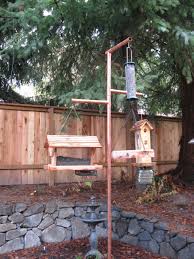 Homemade Bird Feeder Pole Systems How To Build A Copper Bird Feeder Pole Bird Feeder Poles Backyard Birds Feeders Bird Feeder Stands