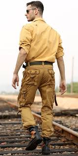 Black And Yellow Cargo Pants Dark Yellow Shirt Brown Pants With Numerous Pockets For Men S Safari Clothing Style Green Fabric Belt Black Leath Safari Outfits Mens Outfits Yellow Pants