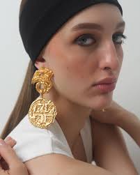 Issa Vibe ✌️ Shop the Medallion Earrings & Kingsuki Bangles at  www.shopanatina.com . . . #shippingworldwide #anatina #goldplatedjewelry  #statementjewelry