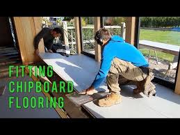 Chipboard flooring sheets connect together in a tongue and groove method. Chipboard Flooring How To Lay P5 Tongue And Groove Chipboard Flooring Youtube