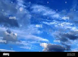 Beautiful Mixed Cloud Formation With White And Grey Cumulus Clouds In The Sunlight Stock Photo Alamy