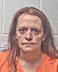 Woman charged in pedestrian death