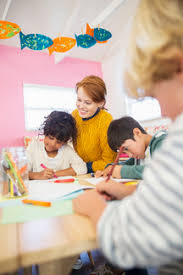 Maybe you would like to learn more about one of these? Students And Teacher Drawing In Classroom Stockphoto