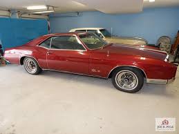 Image result for Riviera Red 1966 Buick