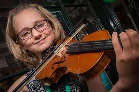 Charity violin busker Madison Glinski, 12, from St Ives, who raised more  than £50,000 is told she must stop playing due to curved spine