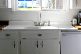 How to assemble and install kitchen wall cabinets. Installing Antique Iron Kitchen Sink With Drainboard Home Design Regarding Measurements 1100 Farmhouse Sink Kitchen Vintage Kitchen Sink Vintage Farmhouse Sink
