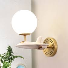 60 watts bulb give warm and soft light that can be on all night if your son is afraid of dark. Cartoon Airplane Wall Lamp Resin 1 2 Head Bedside Wall Sconce In White And Gold With Ball Milk Glass Shade Beautifulhalo Com