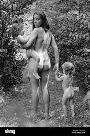 Naked woman and two small children outside, woman looking over shoulder,  b&w Stock Photo - Alamy