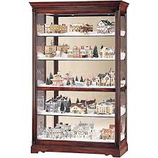 While curio cabinets are usually found in traditional design schemes, don't fret if that's far from your decorating style. Howard Miller Townsend Curio Cabinet 680 235 Windsor Cherry Finish Home Decor Five Glass Shelves Display Case With Locking Slide Door Amp Light Switch Walmart Com Walmart Com