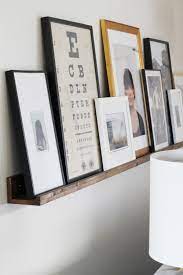 How To Diy An Art Ledge Gallery Wall Living Room Living Room Diy Picture Ledge